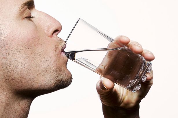a-man-drinking-water